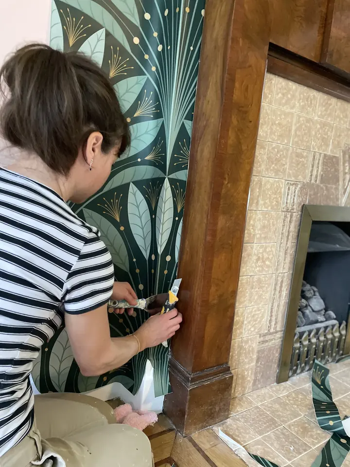 Botanical wallpaper detail in a period reception room