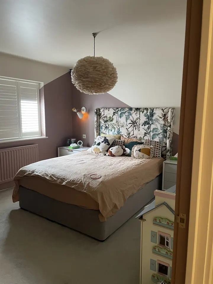Geometric bedroom feature wall with crisp painted linework