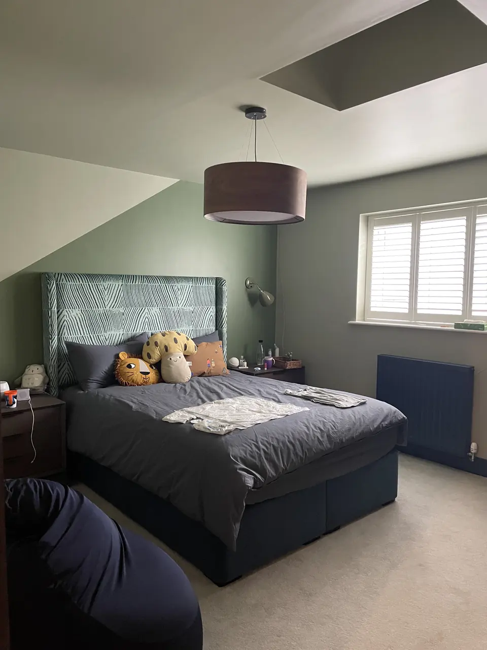 Finchley bedroom feature walls with deep paint colour, crisp geometry and hand-finished edges